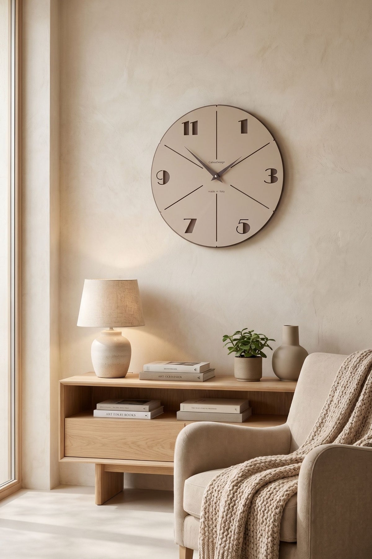 CalleaDesign Aurelio wall clock in Café Latte finish in a warm contemporary living room