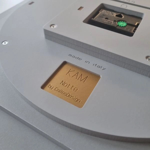 Back of the KAM Notte wall clock with engraved name, CalleaDesign signature and Made in Italy detail