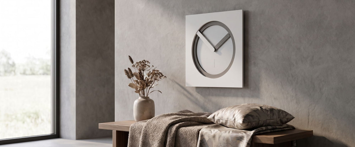 KAM wall clock by CalleaDesign in a neutral interior above a wooden bench