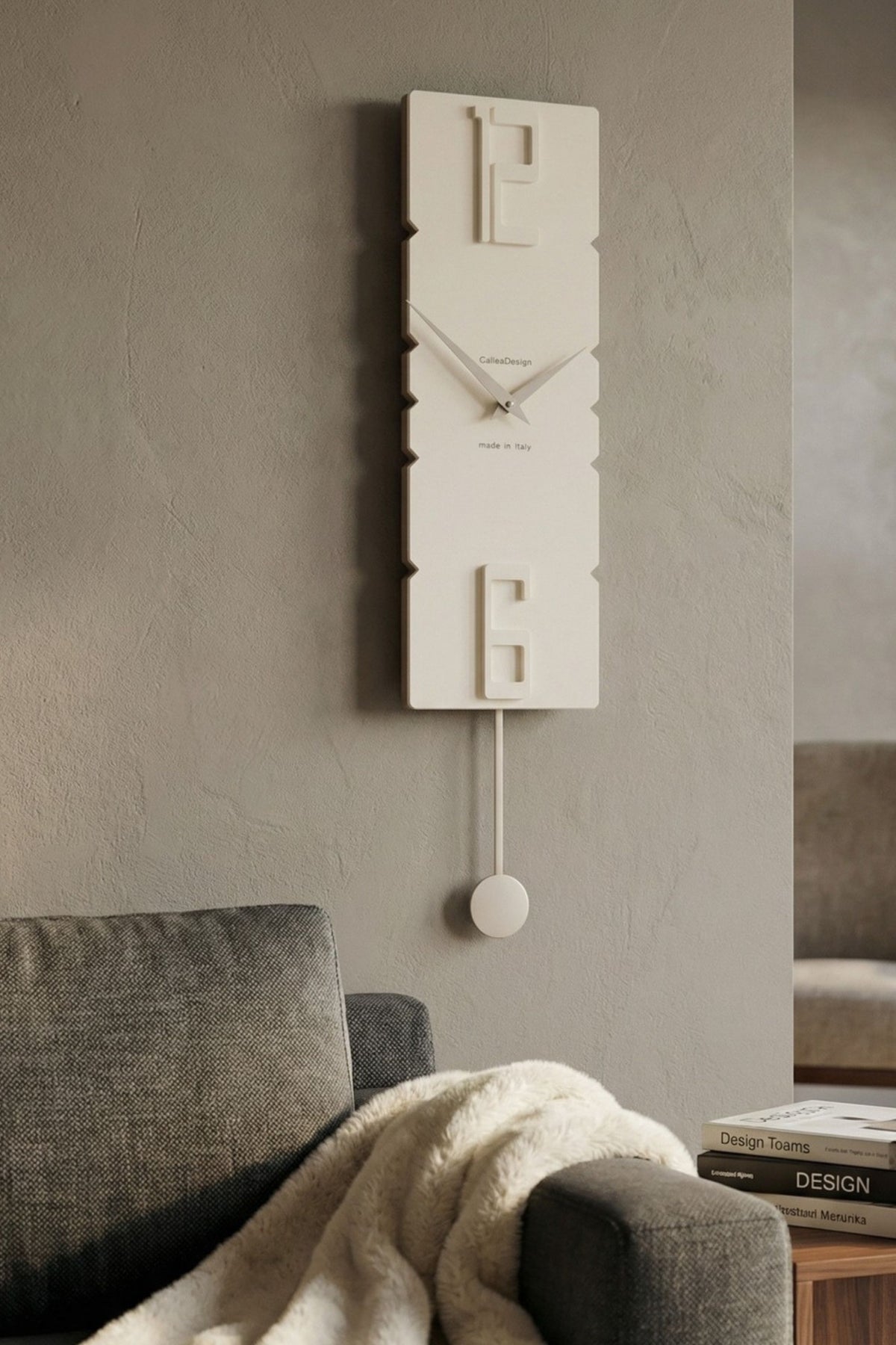 CalleaDesign Rock pendulum clock in white finish in a warm contemporary interior
