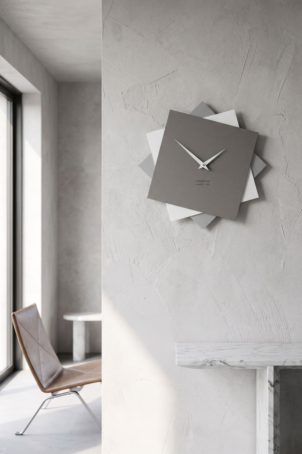 CalleaDesign Foy wall clock in Quartz Grey in a bright minimalist interior