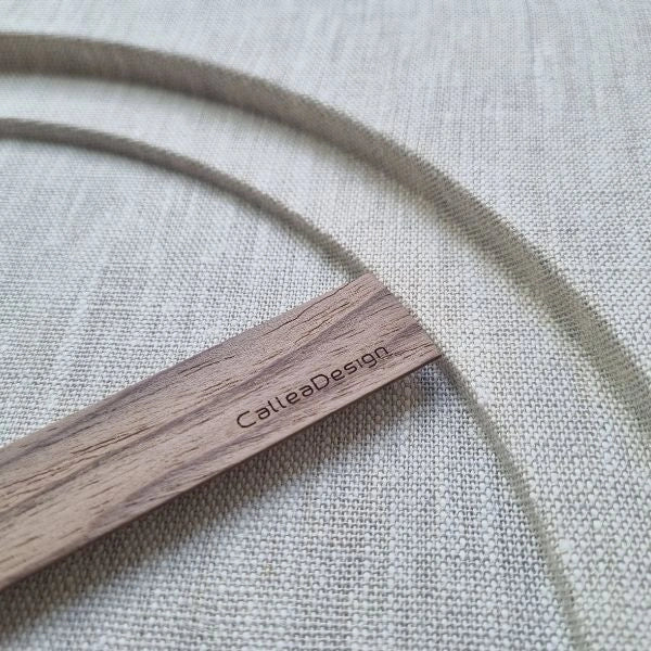 KAM 1 Limited Edition detail with Canaletto walnut hand and natural linen texture