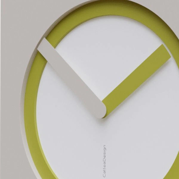 Close-up of the KAM Linfa wall clock with a lime green ring and contrasting pale hands