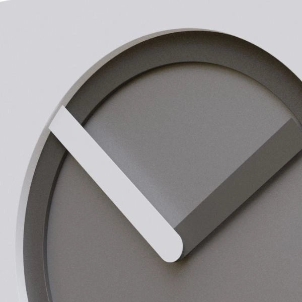 Close-up of the KAM Nebbia wall clock with layered grey dial and contrasting white and grey hands