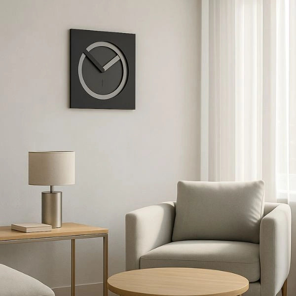 KAM Notte wall clock displayed on a light wall above a side table in a contemporary living room